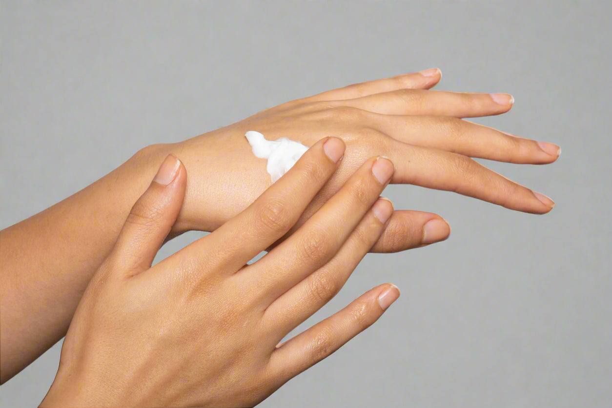 Tallow and beeswax hand cream being applied